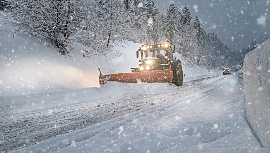 Equipment removing snow on winter roads.